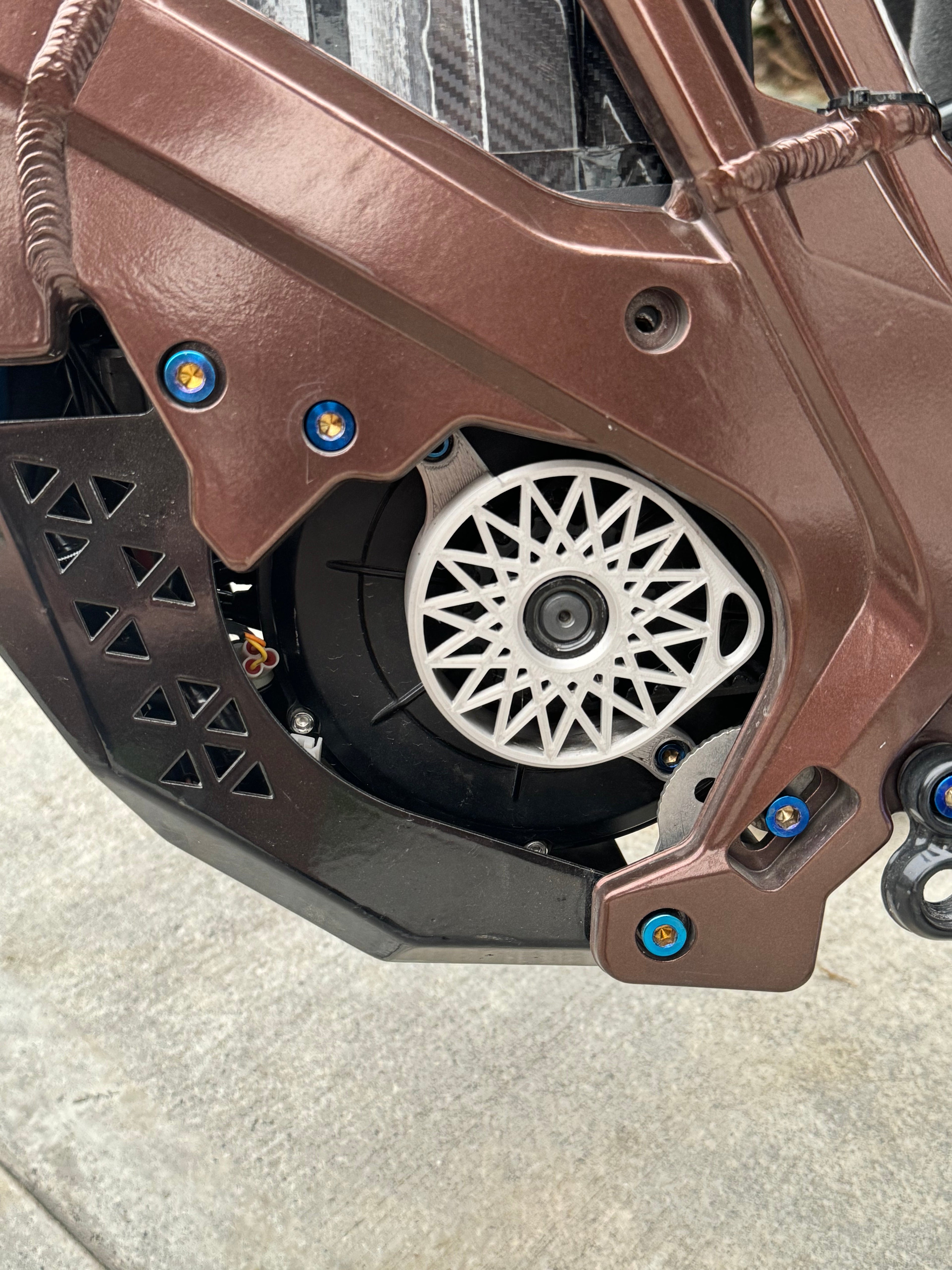 Skid plate titanium by Mxp_designs, showcasing a sleek, durable titanium skid plate with a brushed finish and precise mounting holes.