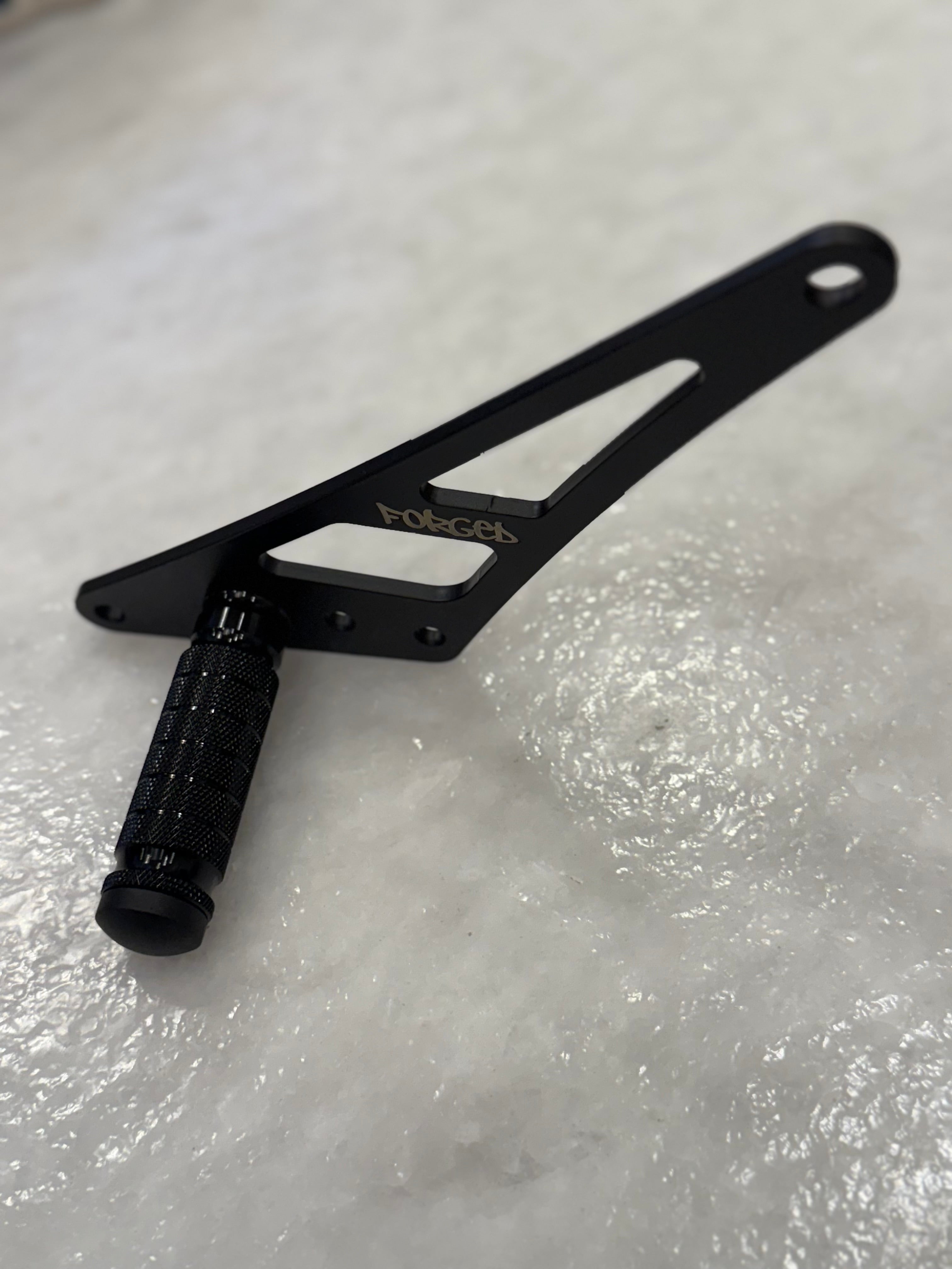 Forged Racing Talaria XXX Bracket Footlock, showcasing a robust design with a secure locking mechanism for racing applications.