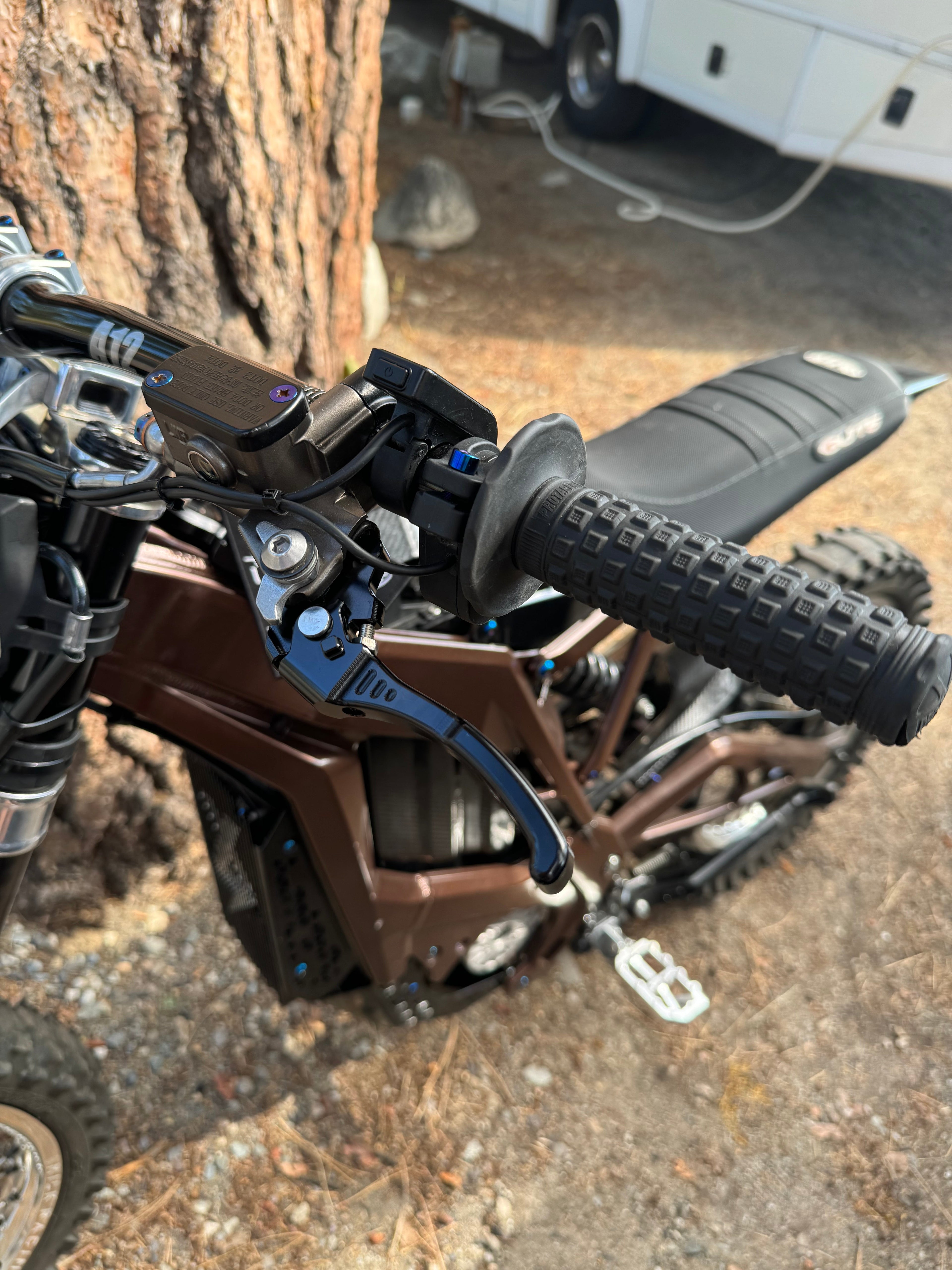 Upgraded Moto brake lever from Mxp_designs, showing a sleek metal handle with detailed grip and mounting point on a white background.