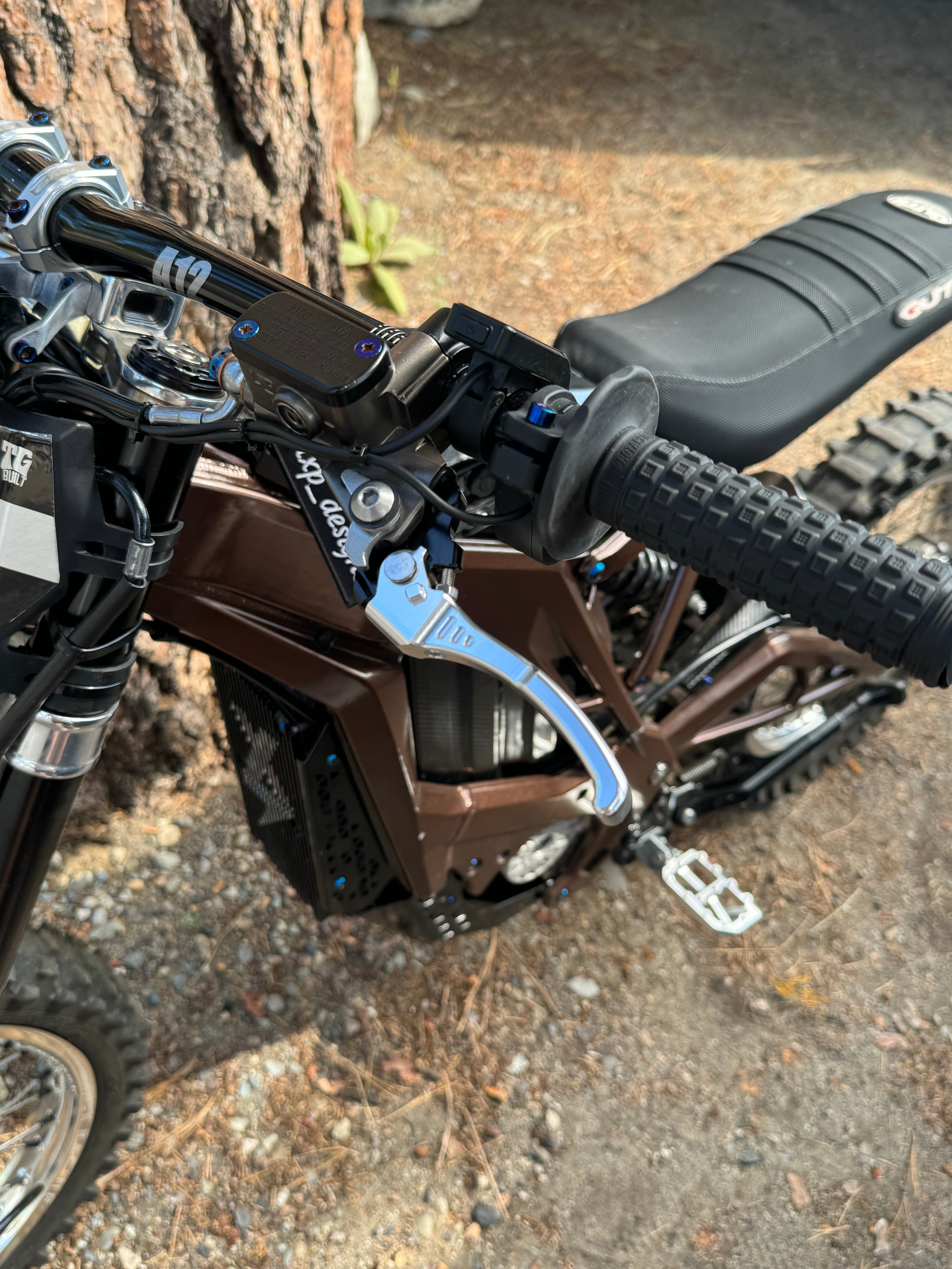 Upgraded Moto brake lever by Mxp_designs, showcasing a sleek metal design with ergonomic grip for motorcycle control.