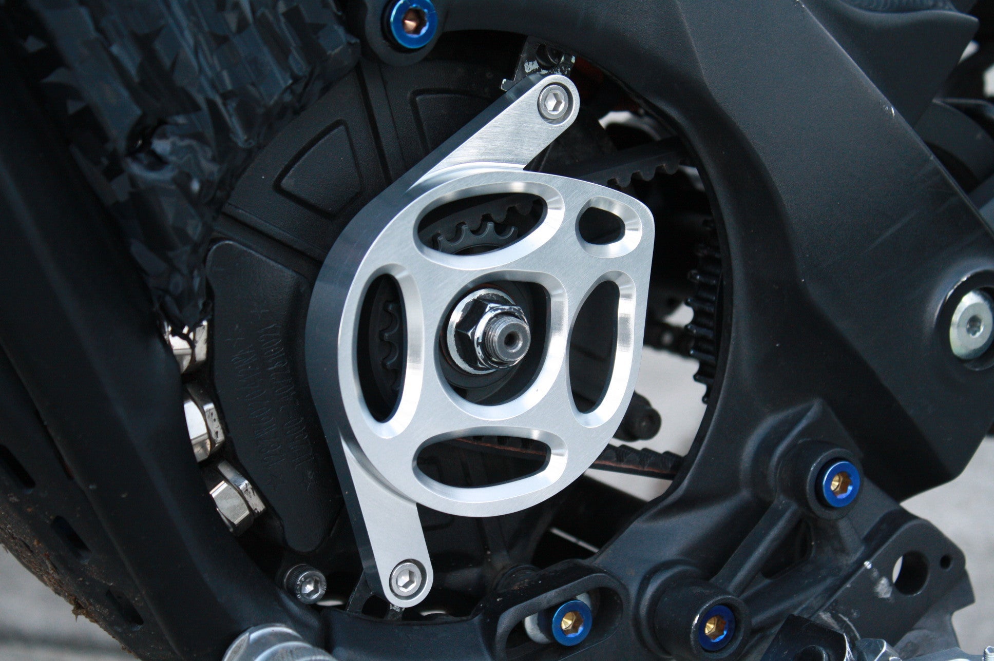 Mxp_designs Talaria XXX motorcycle cover protecting a sleek black motorcycle from dust and weather elements.