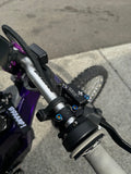 Mxp_designs Formula titanium brake mount bolts installed on a bicycle for lightweight, durable braking system components.