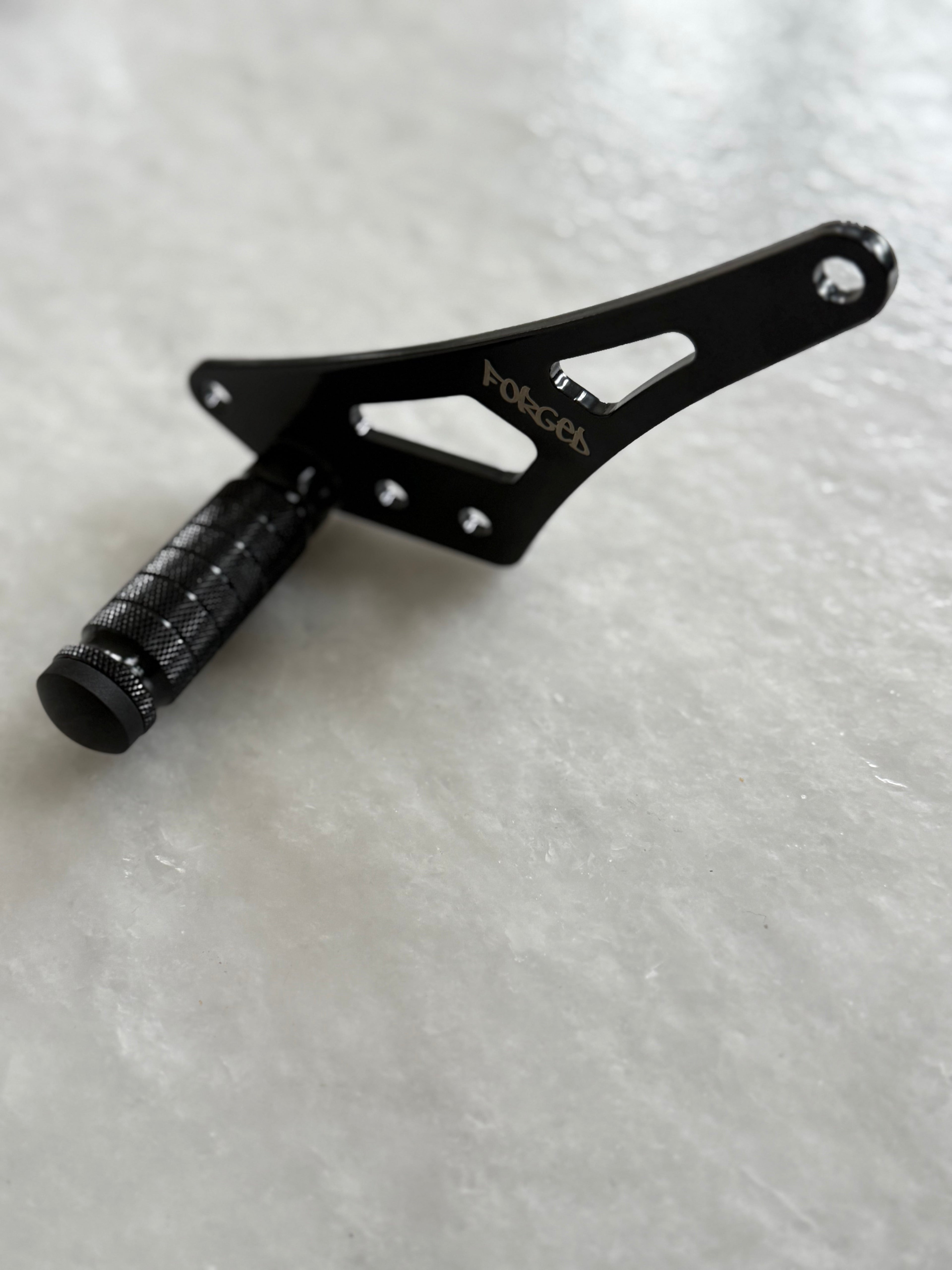 Forged Racing Talaria XXX Bracket Footlock featuring a durable design for secure foot positioning in racing applications.