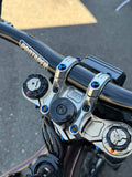 Mxp_designs direct stem riser mount bolts shown on a bike handlebar for secure attachment and adjustment.