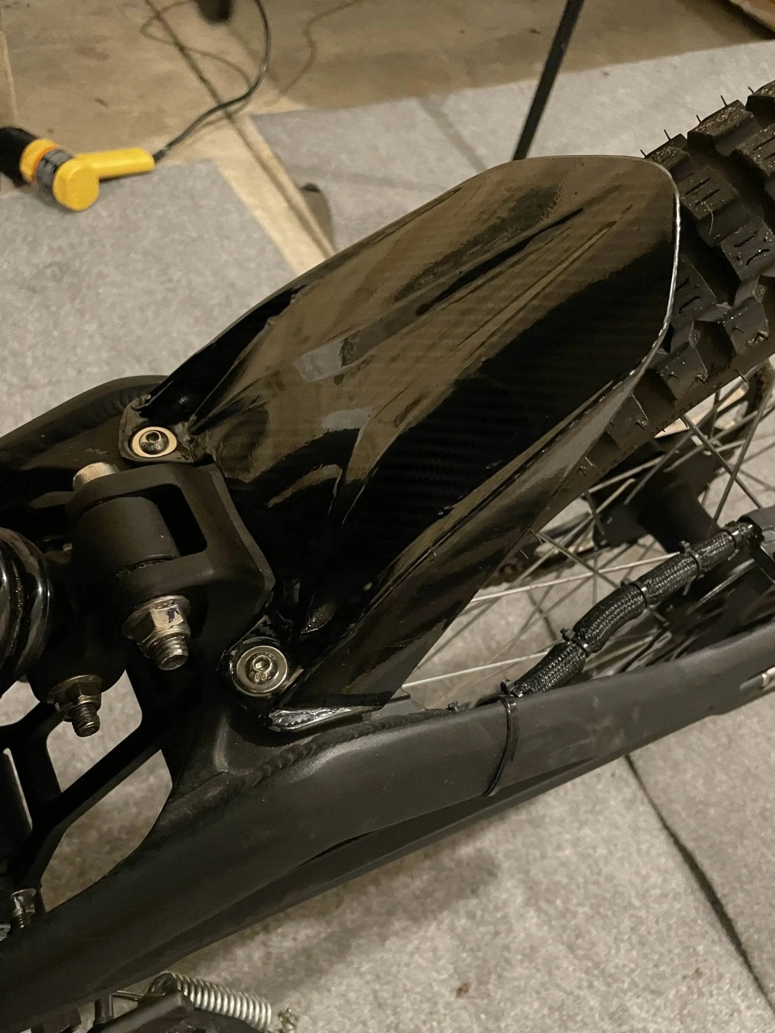 Carbon fiber vinyl wrap kit for Talaria Mx3/Mx4 by MXwraps, featuring textured black and gray carbon fiber pattern.