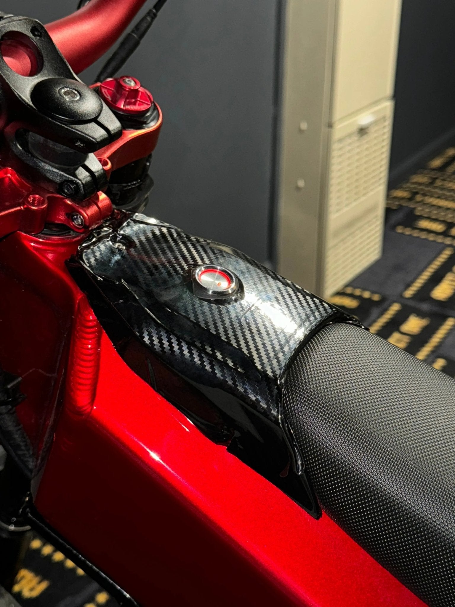 MXwraps Talaria XXX Carbon Fiber Wrap Kit vinyl wrap with textured carbon fiber finish for vehicle customization.