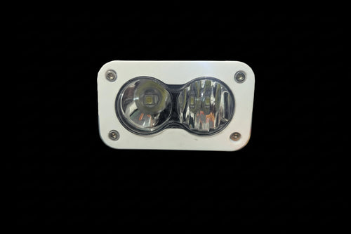 South Coast Moto Baja Light Cover showing durable, black protective cover for motorcycle Baja lights on a vehicle.